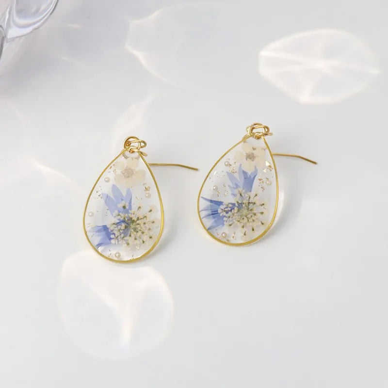 Boucles d'oreilles fleur resine