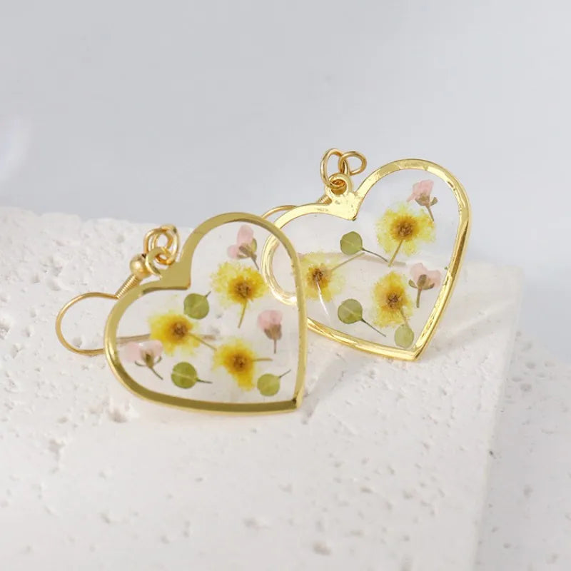Boucles d'oreilles fleur resine