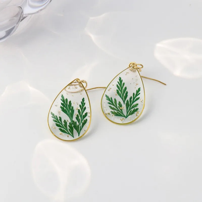 Boucles d'oreilles fleur resine