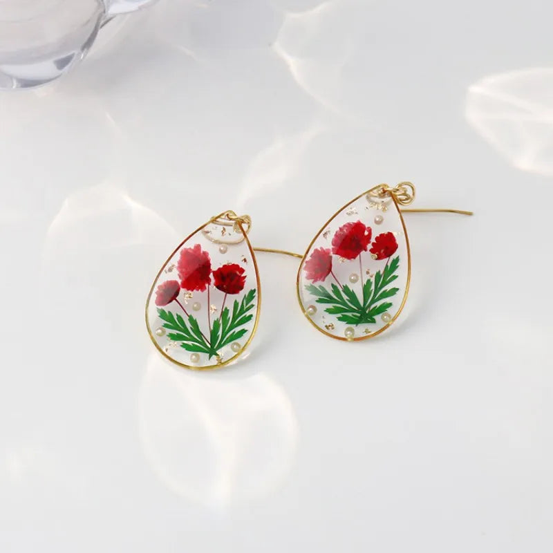Boucles d'oreilles fleur resine