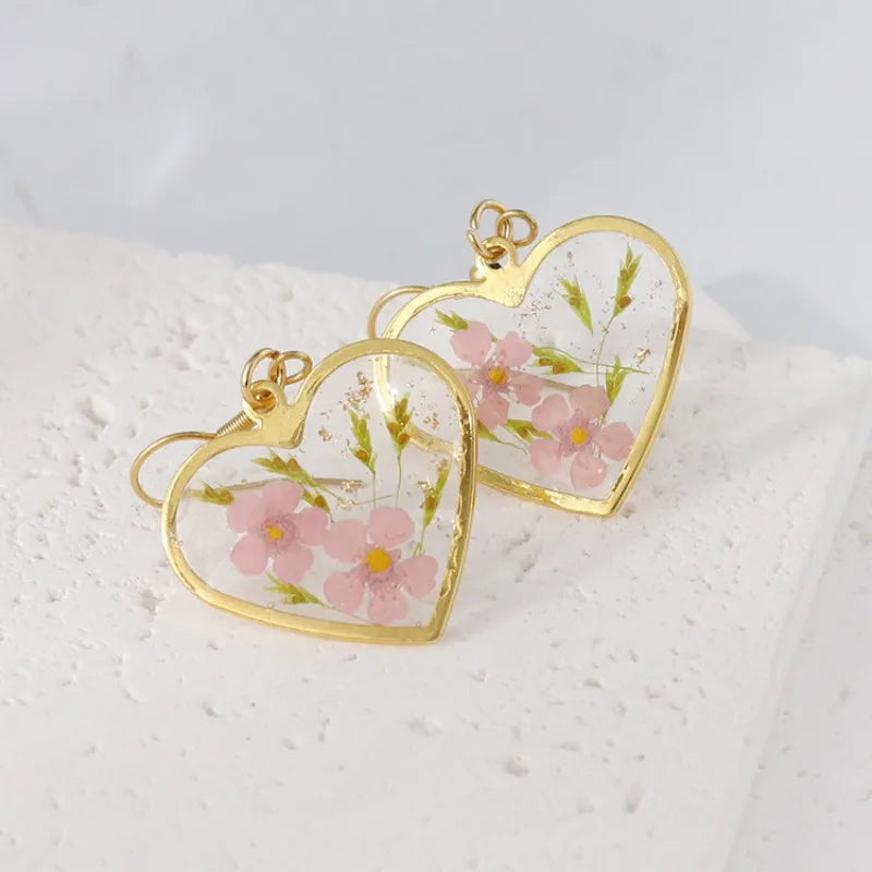 Boucles d'oreilles fleur resine