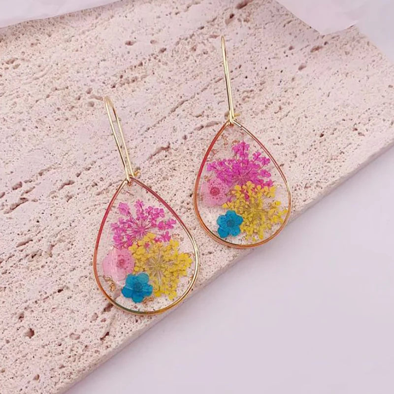 Boucles d'oreilles fleur resine