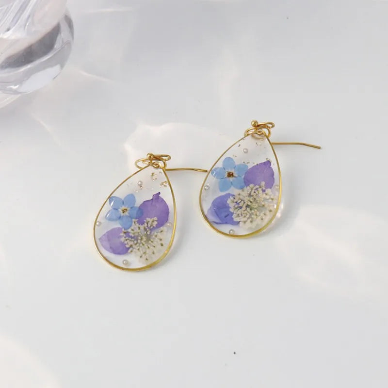 Boucles d'oreilles fleur resine