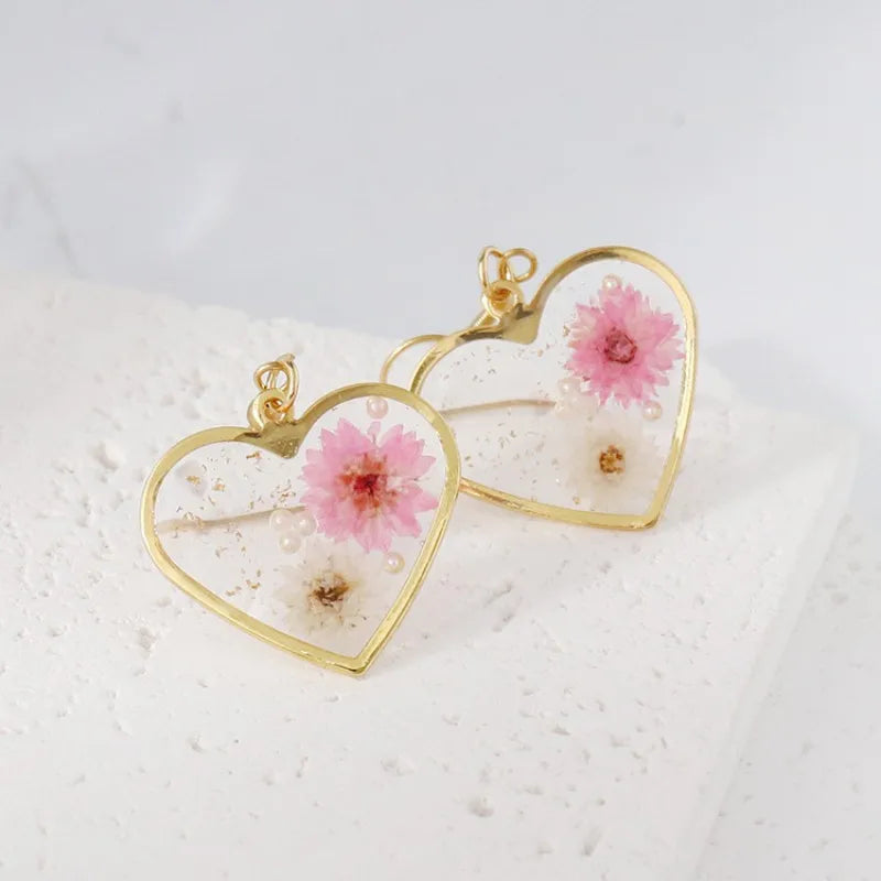 Boucles d'oreilles fleur resine