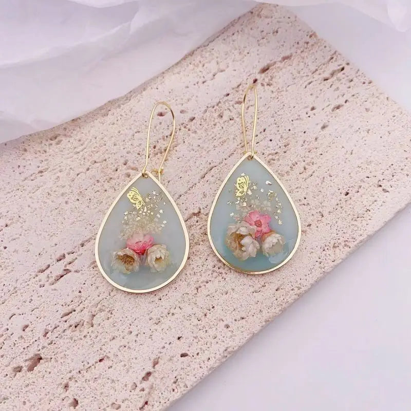 Boucles d'oreilles fleur resine