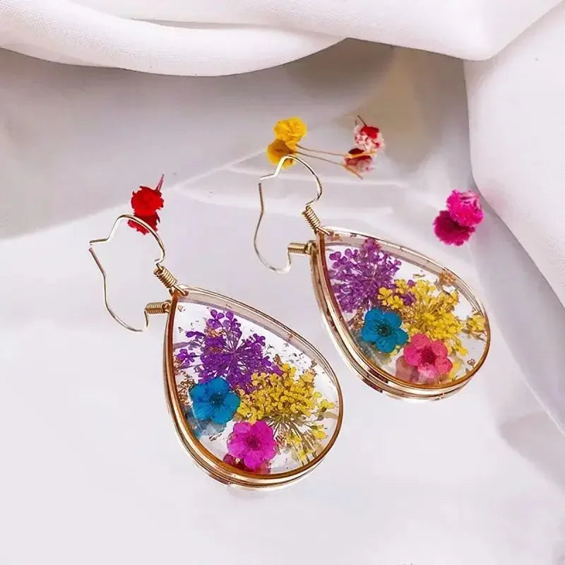 Boucles d'oreilles fleur resine