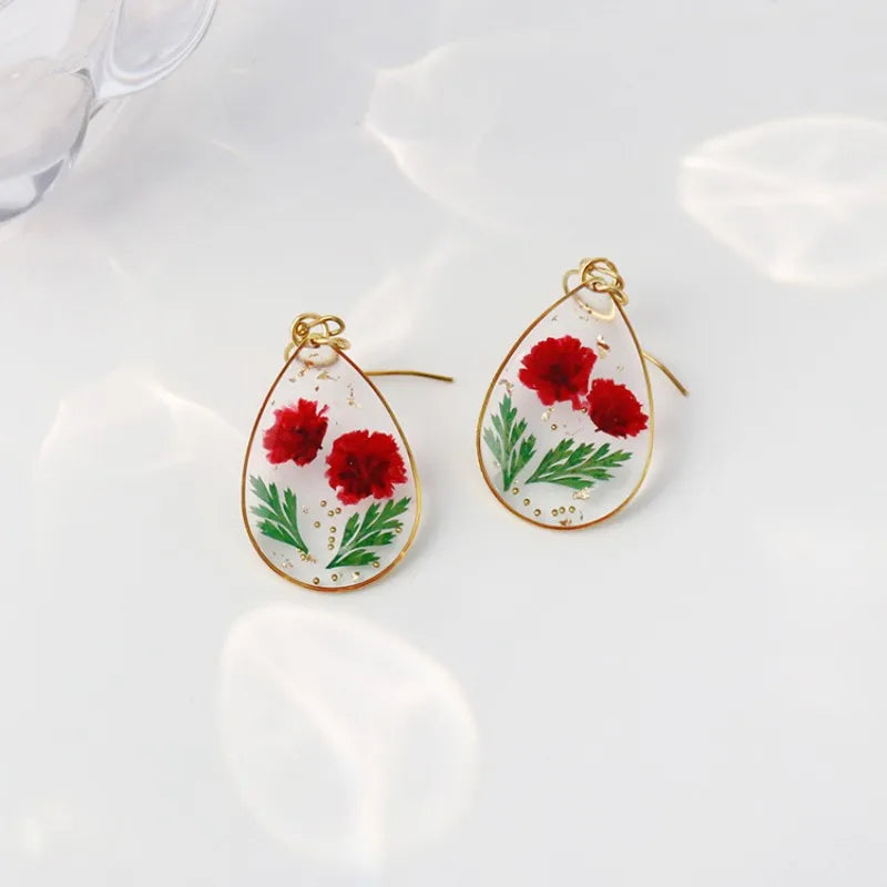 Boucles d'oreilles fleur resine