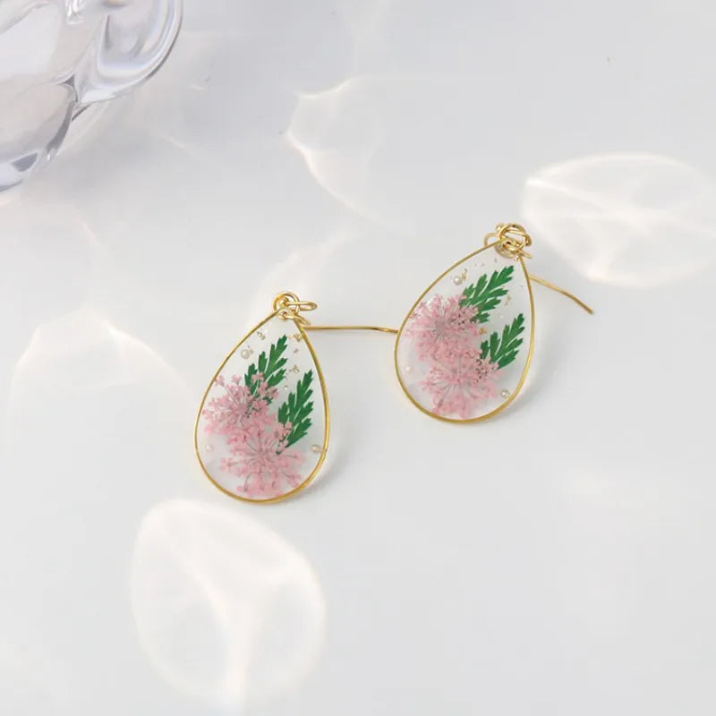 Boucles d'oreilles fleur resine