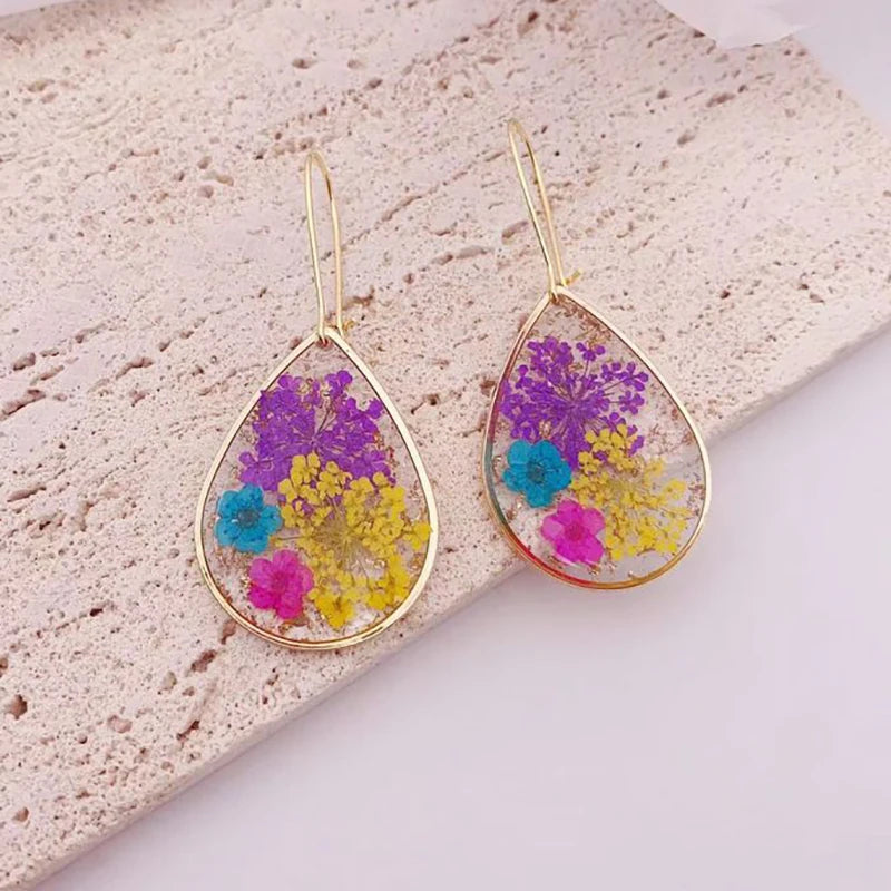 Boucles d'oreilles fleur resine