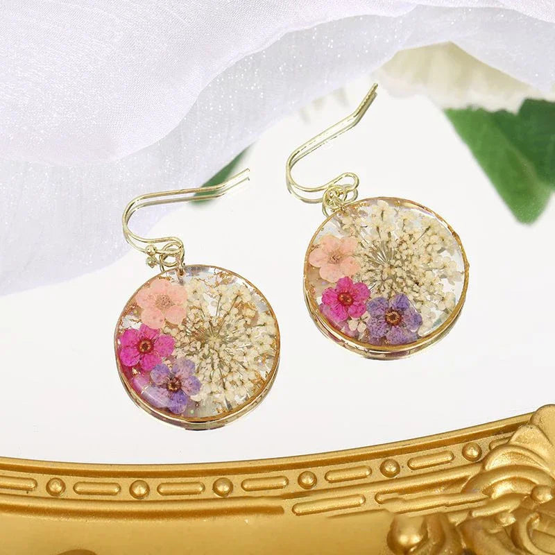 Boucles d'oreilles fleur resine