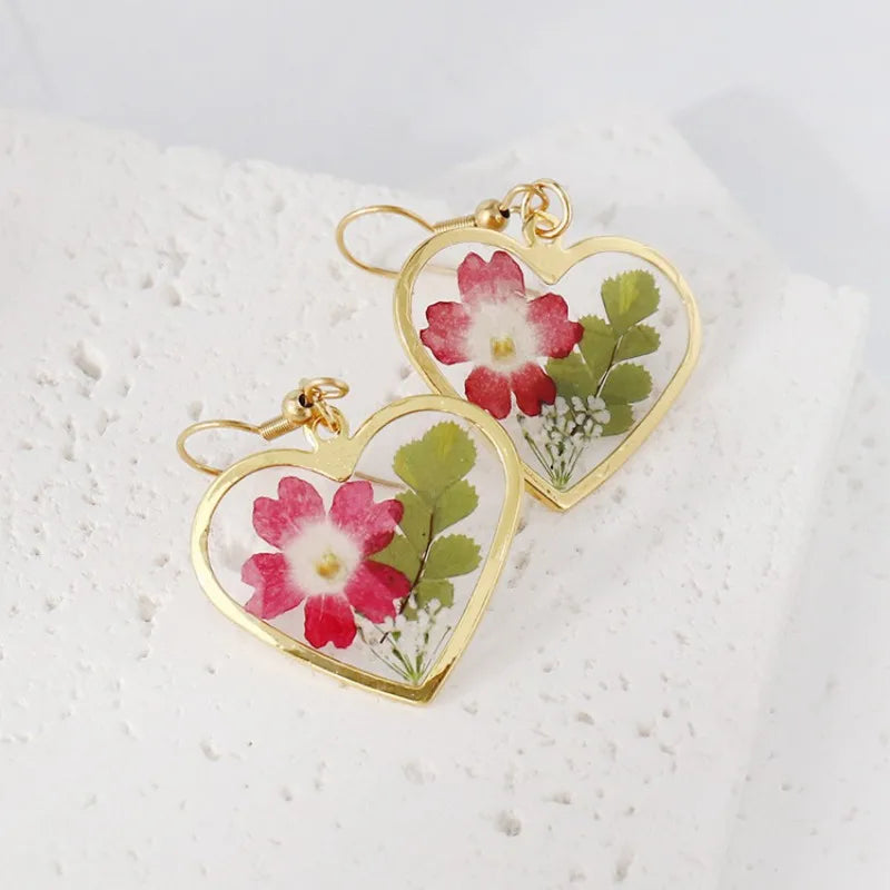Boucles d'oreilles fleur resine