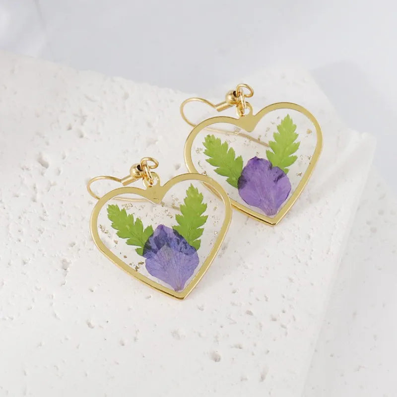 Boucles d'oreilles fleur resine