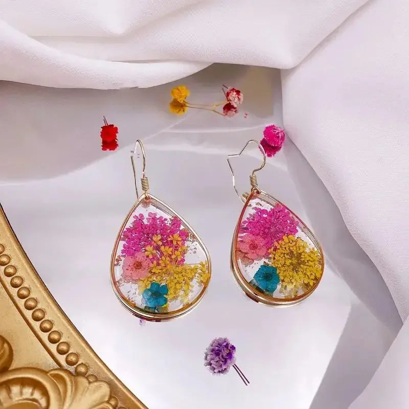 Boucles d'oreilles fleur resine