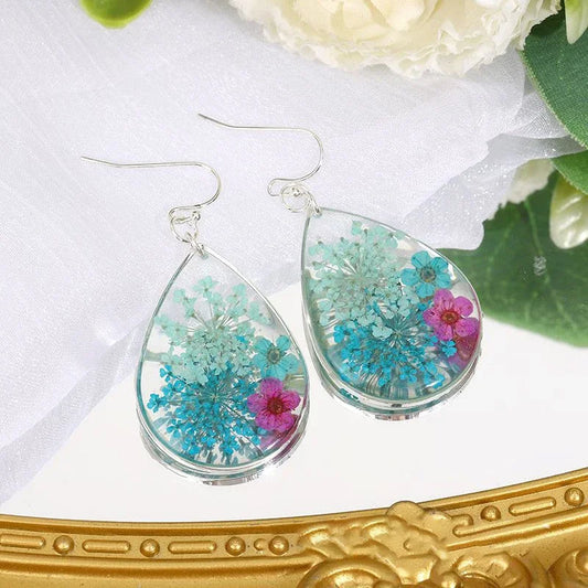 Boucles d'oreilles fleur resine