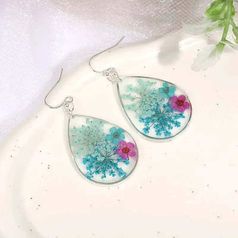 Boucles d'oreilles fleur resine