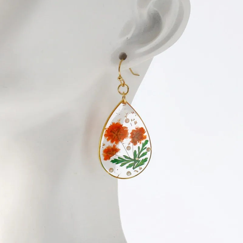 Boucles d'oreilles fleur resine