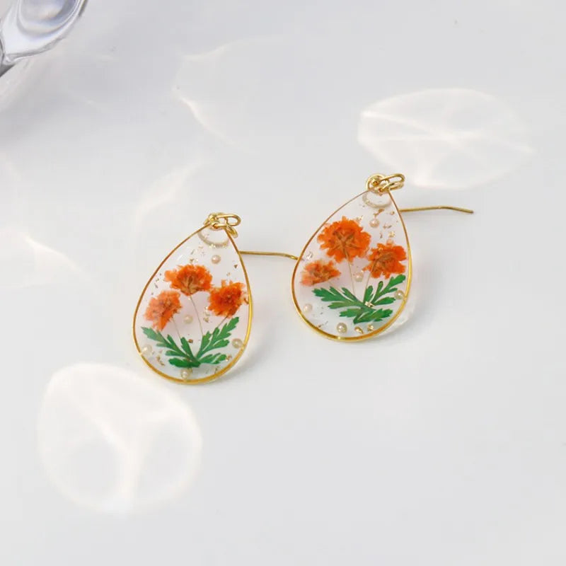 Boucles d'oreilles fleur resine